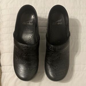 Dansko Black Embossed Slip-On Clogs